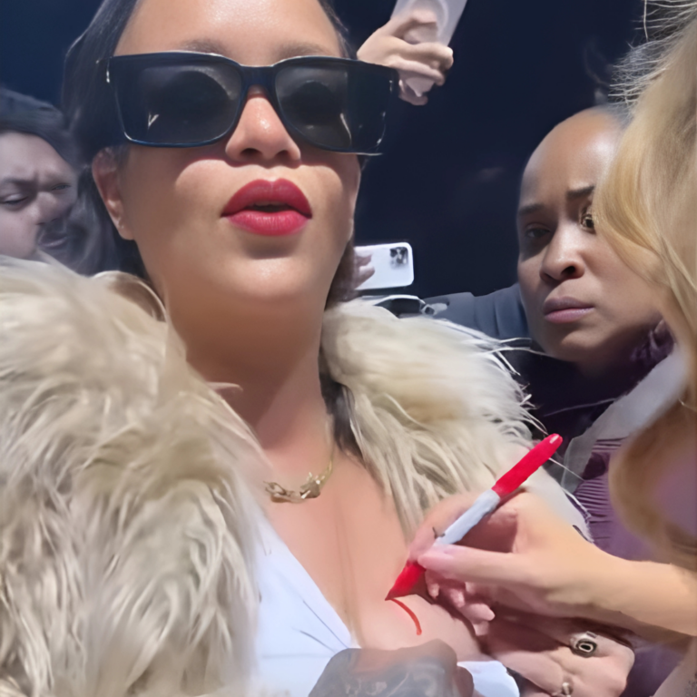 Mariah Carey nënshkruan autograf në gjoksin e Rihanna-s.